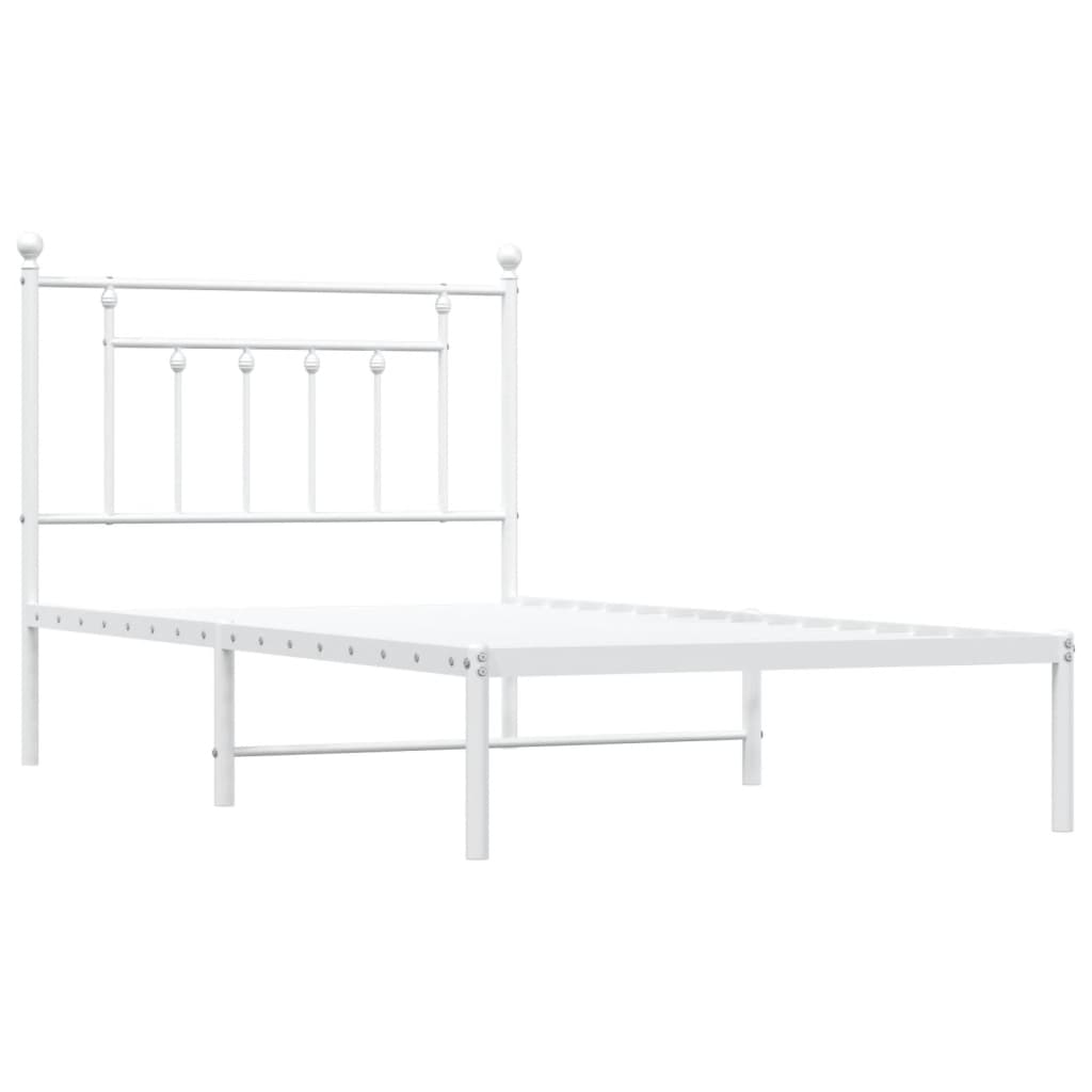 White metal twin bed frame with a headboard and mattress