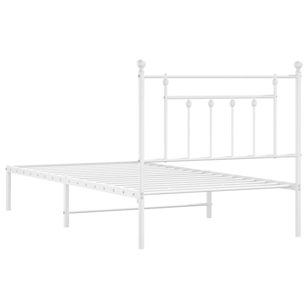 White metal twin bed frame with decorative finials on headboard