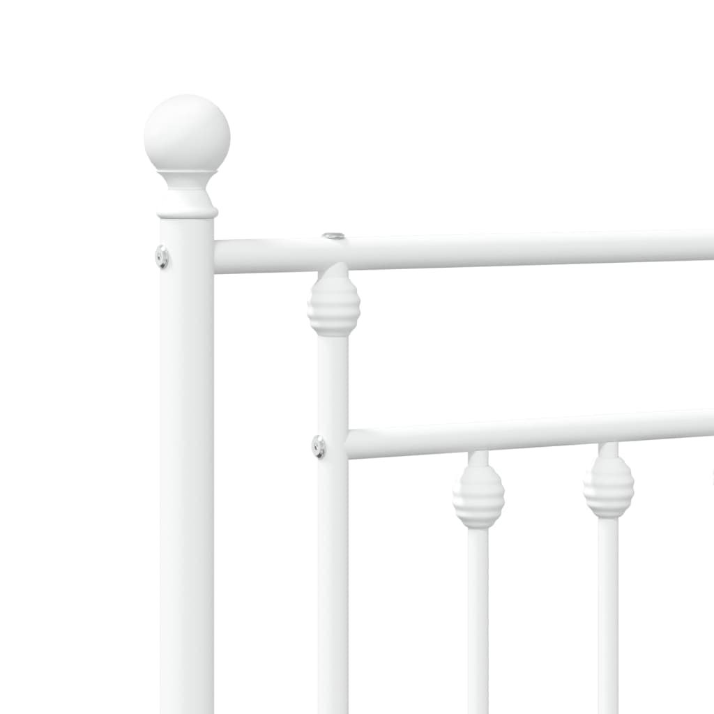 White metal twin bed frame with a decorative headboard and slatted base