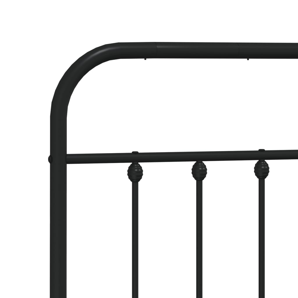 Black metal bed frame with ornate headboard and footboard