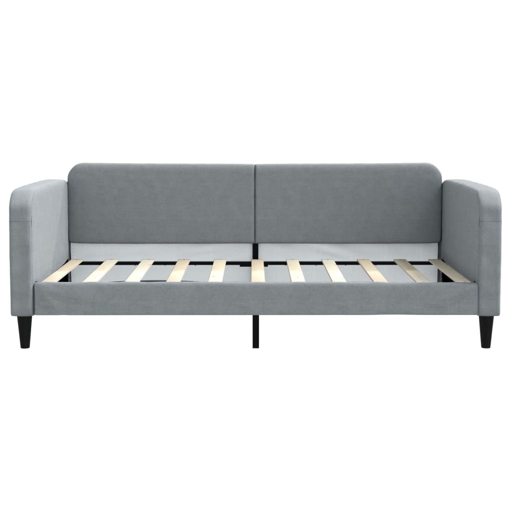 Grey upholstered daybed with wooden slats and black legs