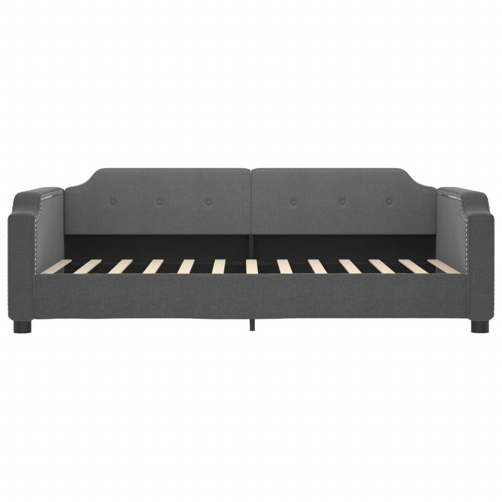 Grey upholstered daybed with studded accents and wooden slats