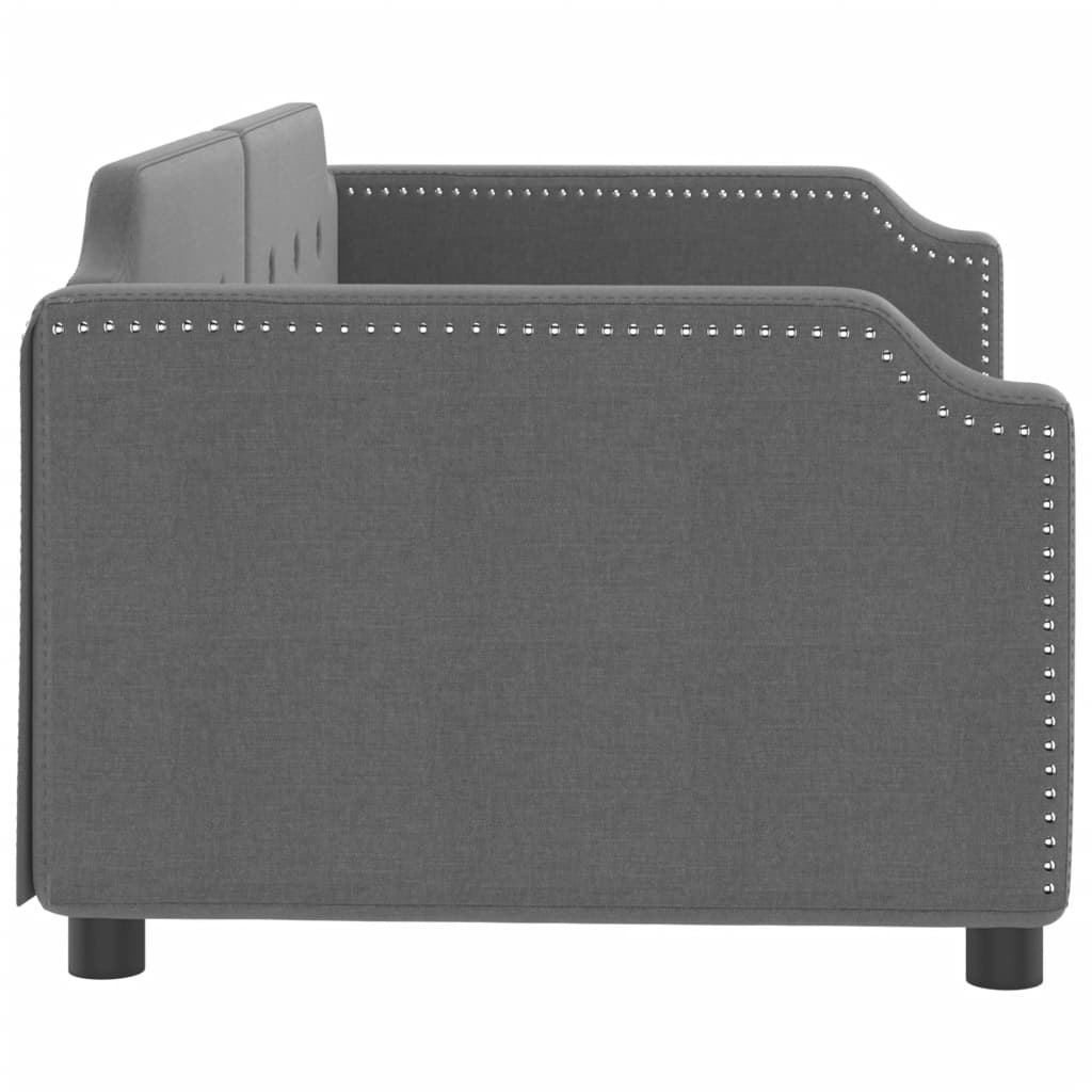 Dark grey fabric daybed with tufted back and metal studded arms