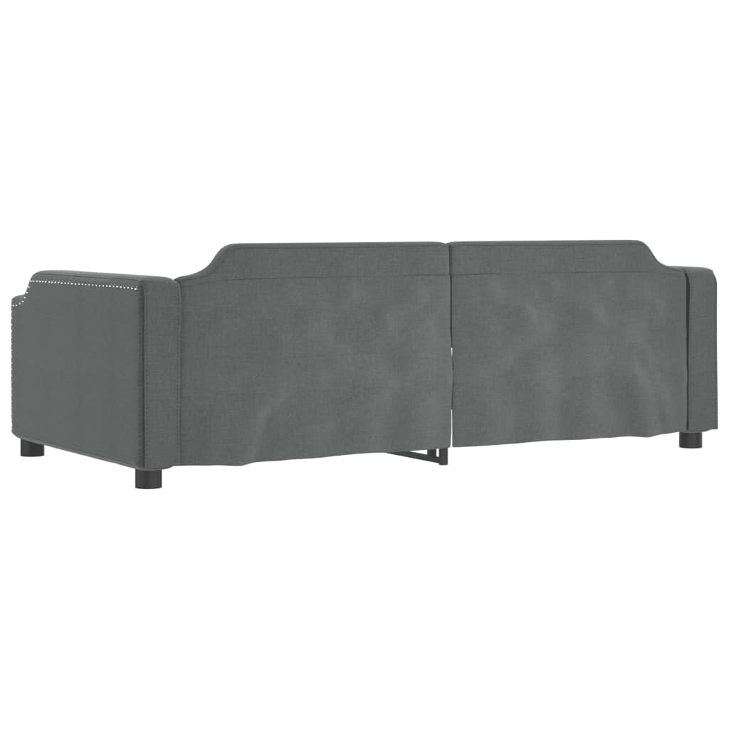 Dark gray upholstered sofa with silver nailhead trim and dark legs