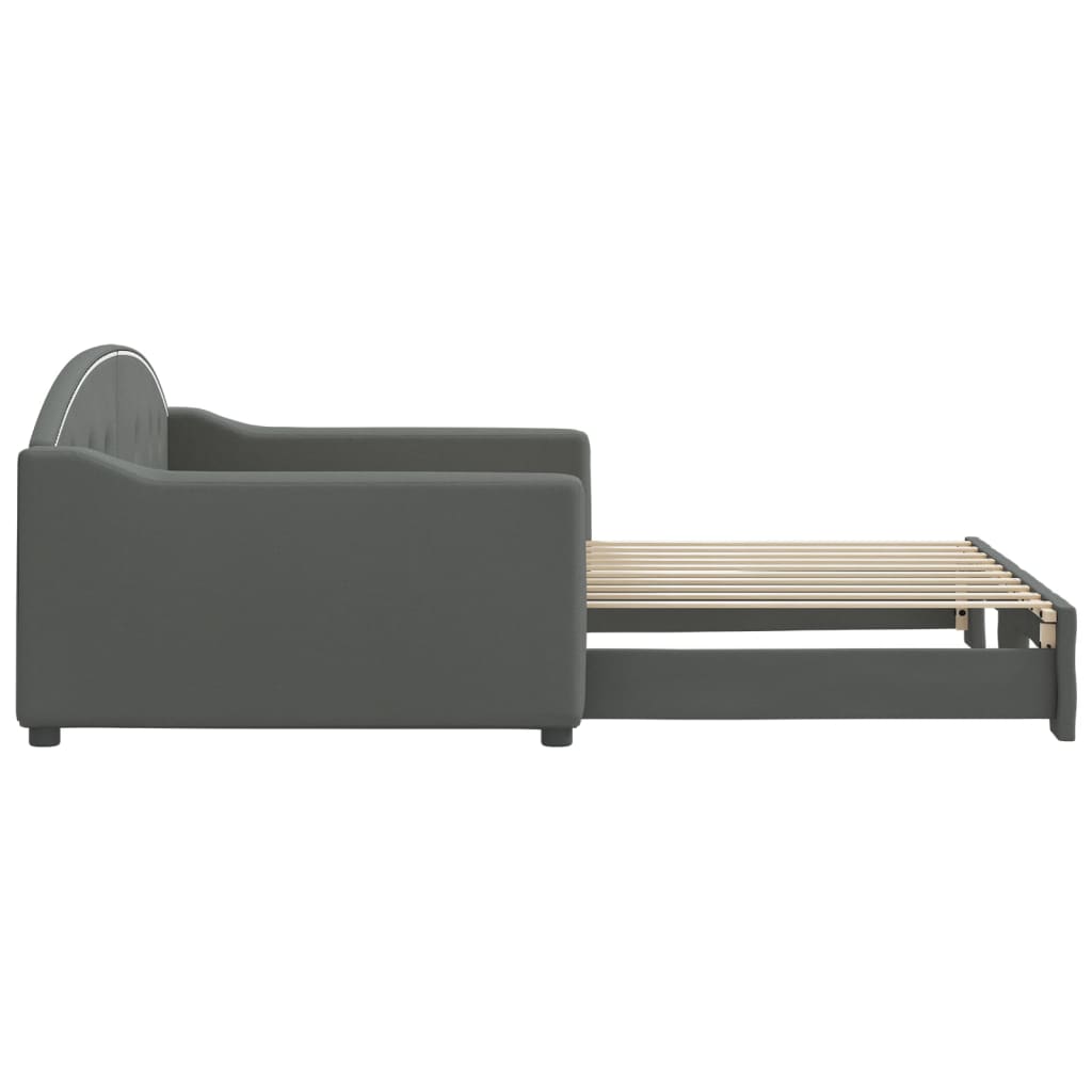 Dark grey upholstered daybed with studded trim and wooden slats