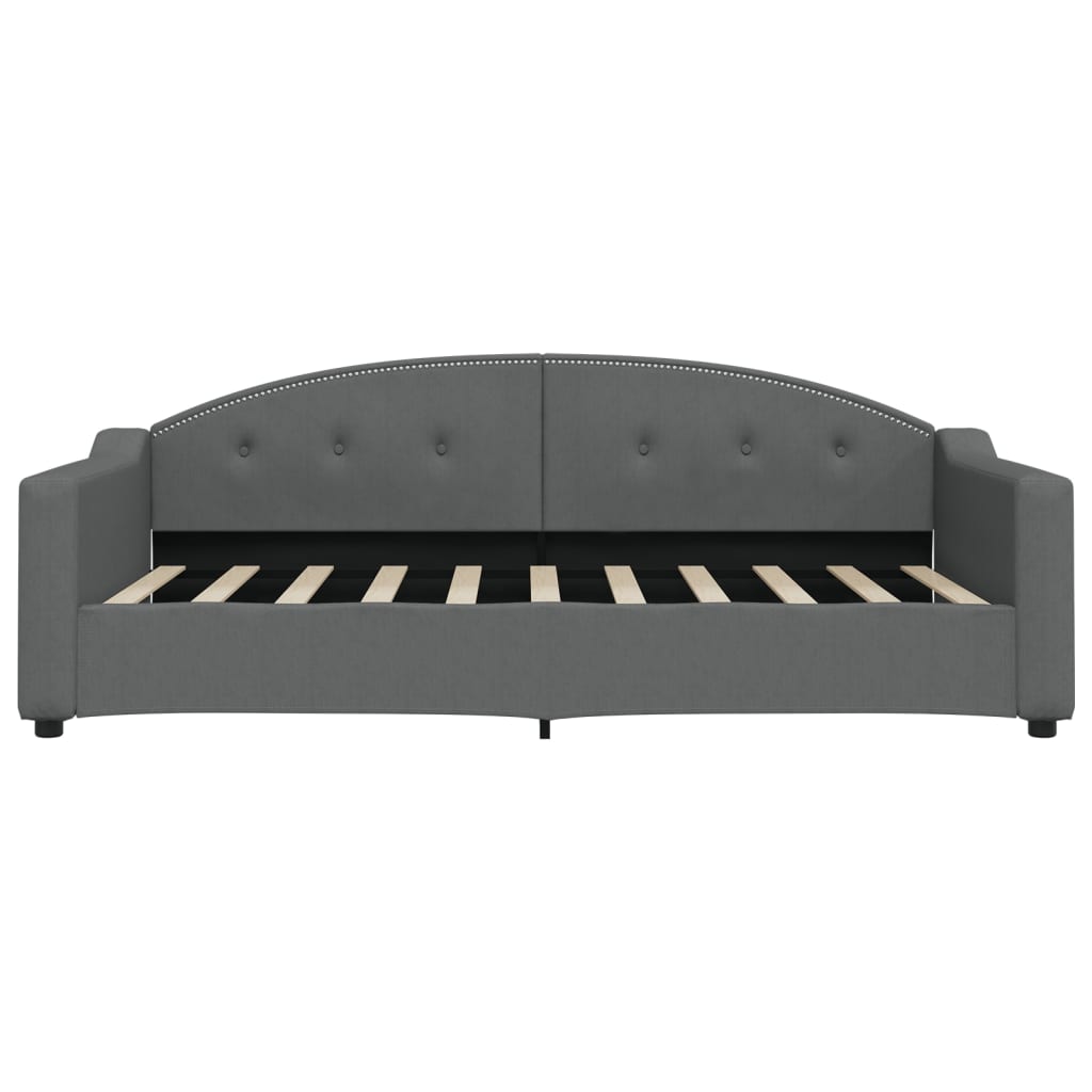 Tufted grey fabric daybed with curved back and wooden slats