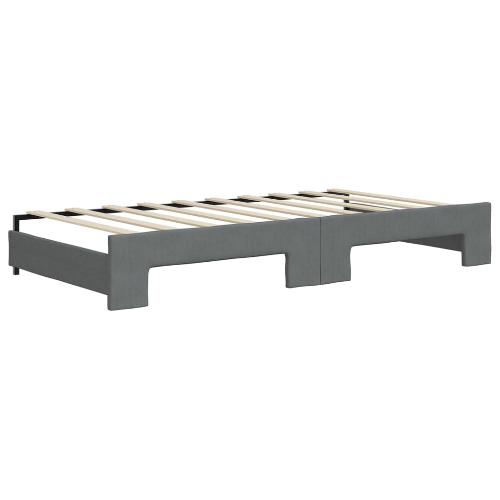 Gray upholstered daybed with button tufting and studded trim