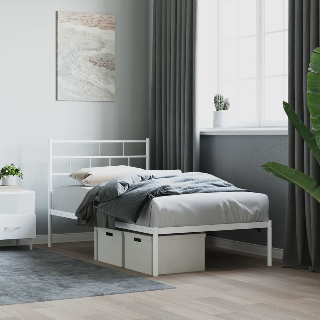 White metal twin bed frame with a slatted headboard and footboard