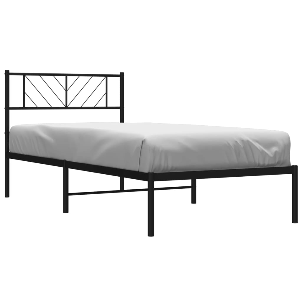 Black metal twin bed frame with geometric headboard and white mattress