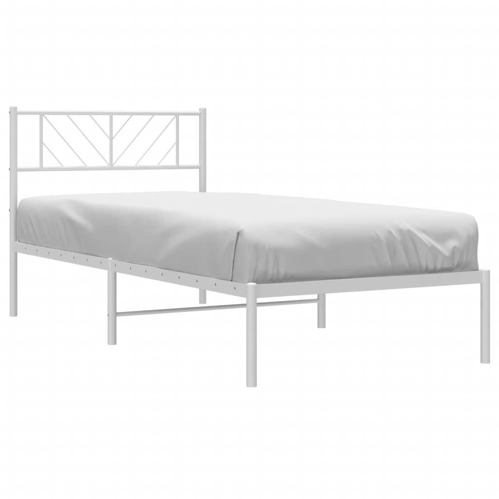 White metal twin bed frame with geometric headboard and mattress