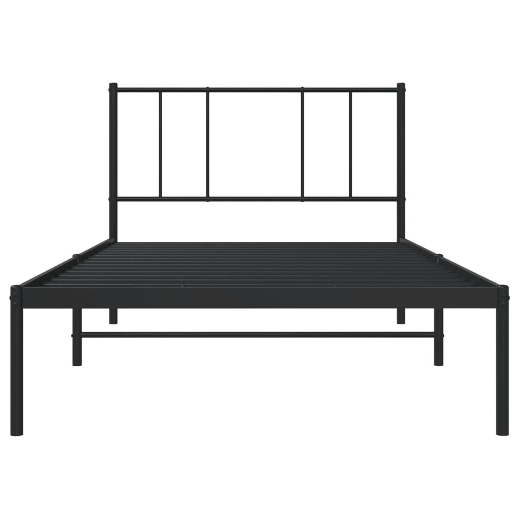 Black metal bed frame with a white mattress and minimalist headboard