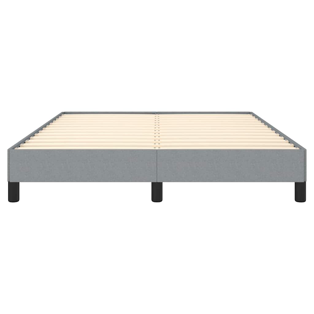 Grey upholstered platform bed frame with wooden slats and black legs