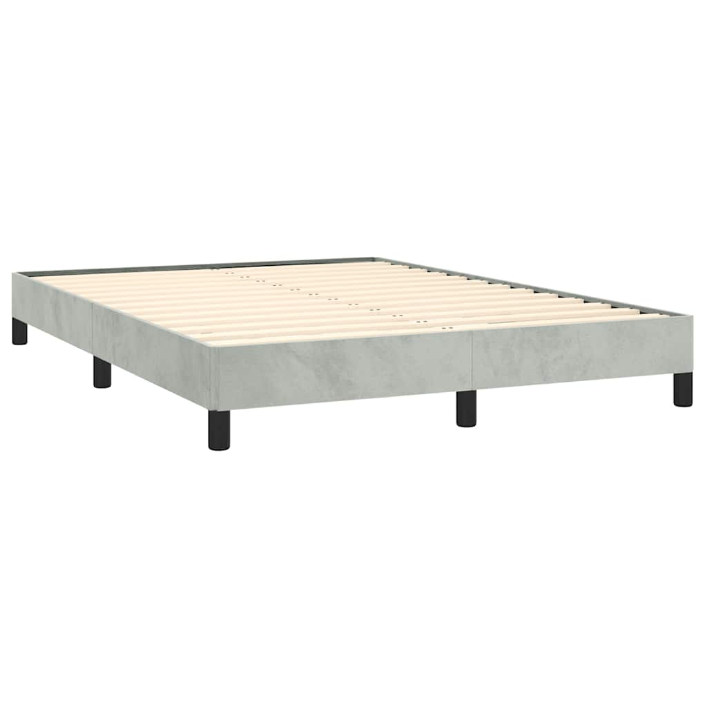 Platform bed frame with light green fabric upholstery and black legs