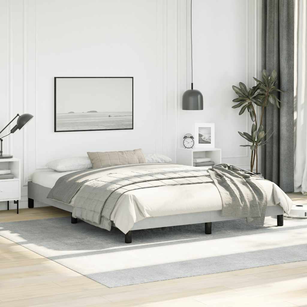 Modern minimalist queen bed frame with white upholstered headboard and grey bedding