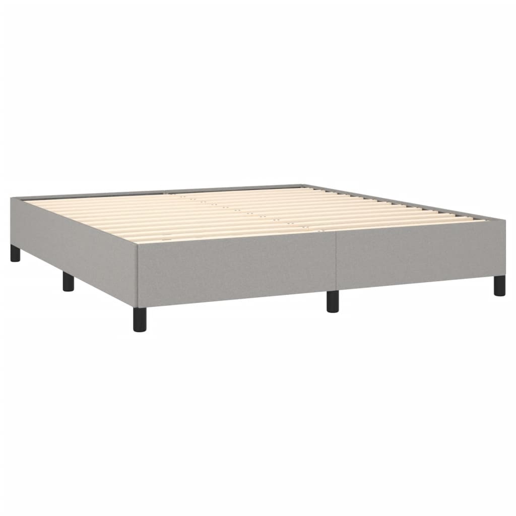 Light grey upholstered queen bed frame with sturdy wooden legs