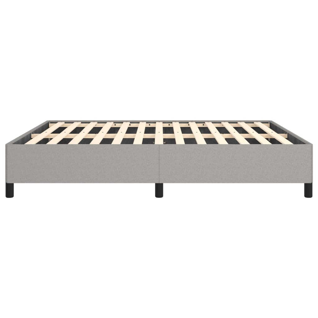 Gray upholstered bed frame with wooden slats and black legs