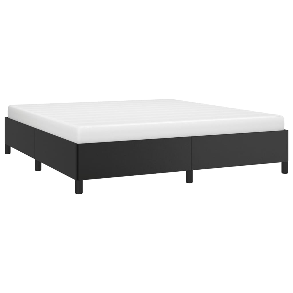 Black upholstered platform bed frame with white mattress