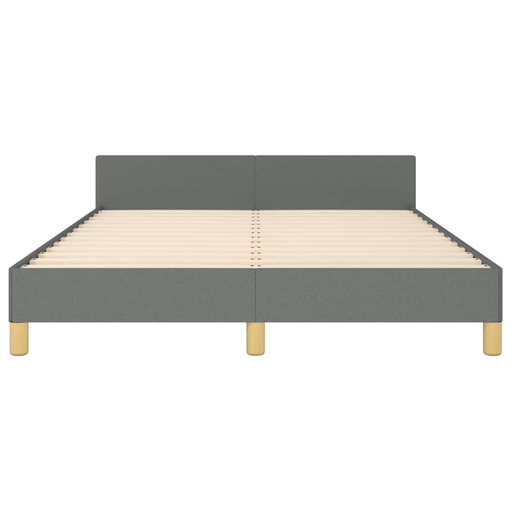 Grey fabric bed frame with white mattress and wooden legs