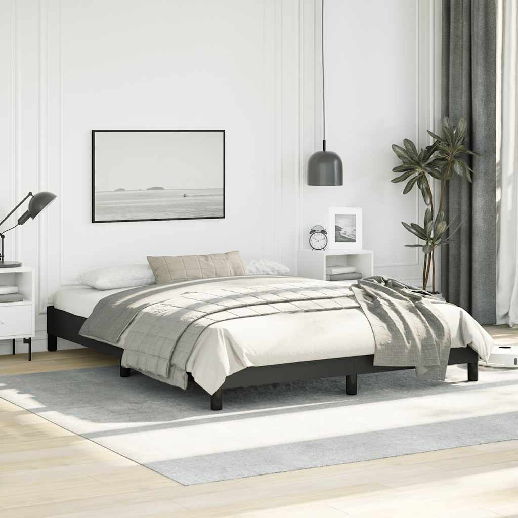 Modern black upholstered bed frame with a white mattress