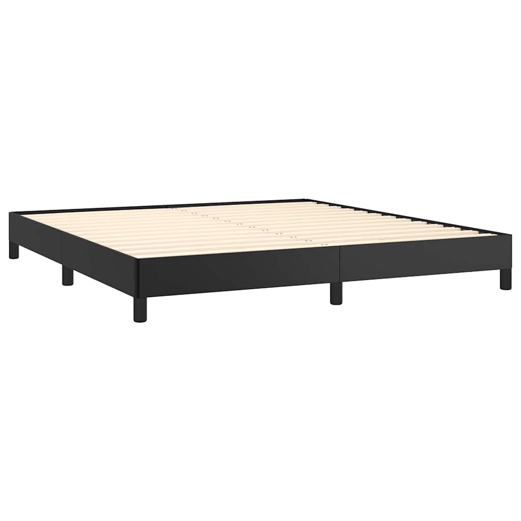Modern black metal platform bed frame with white bedding