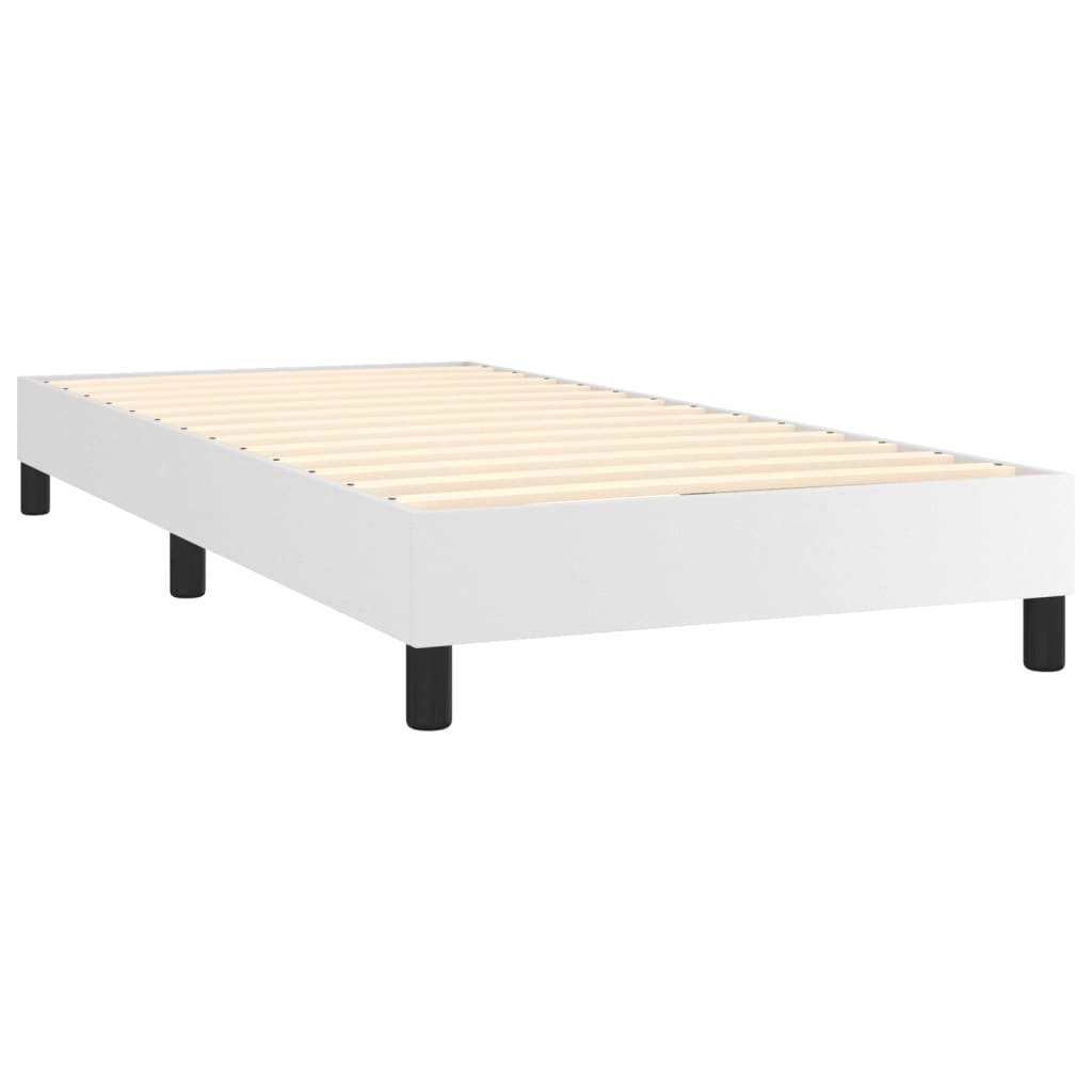 White upholstered bed base with black legs