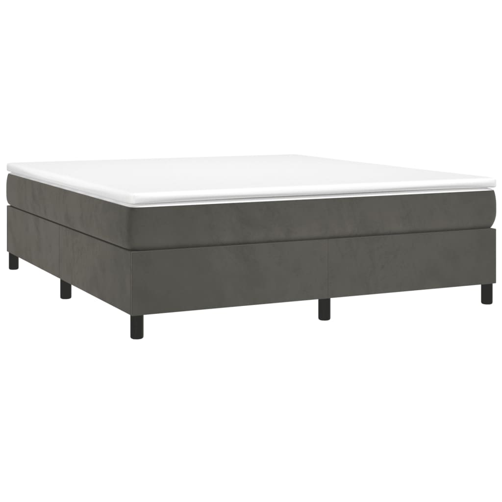 Dark grey upholstered bed frame with white mattress