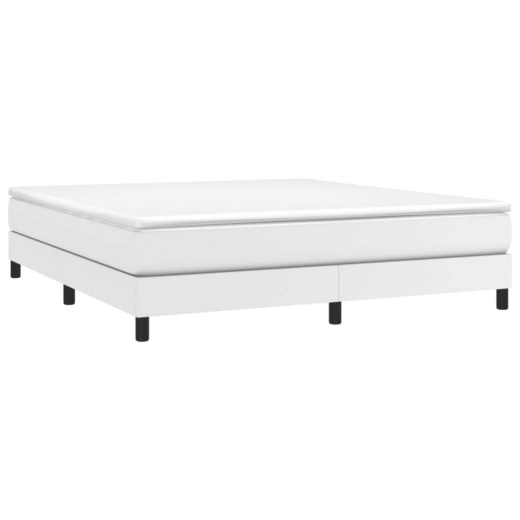 Modern white bed frame with a white mattress and black legs