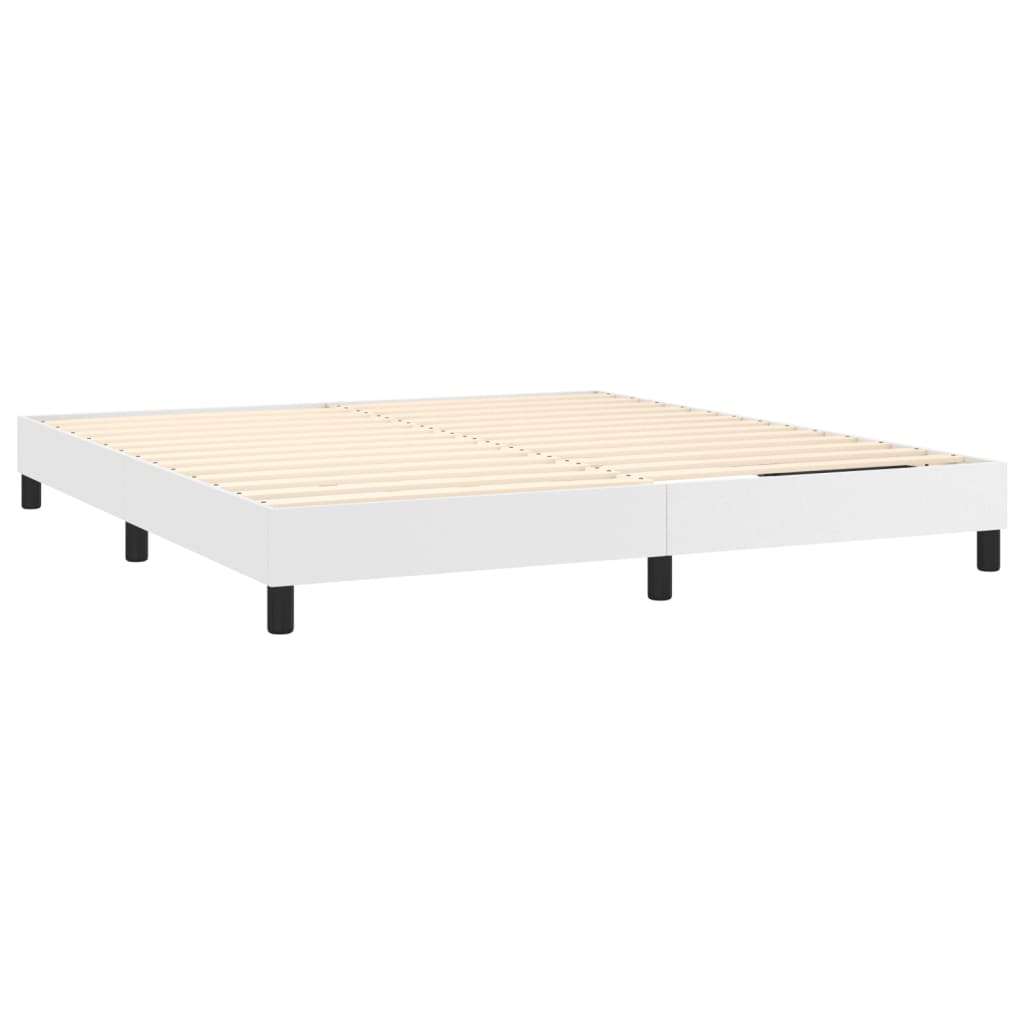 White upholstered divan bed base with black legs
