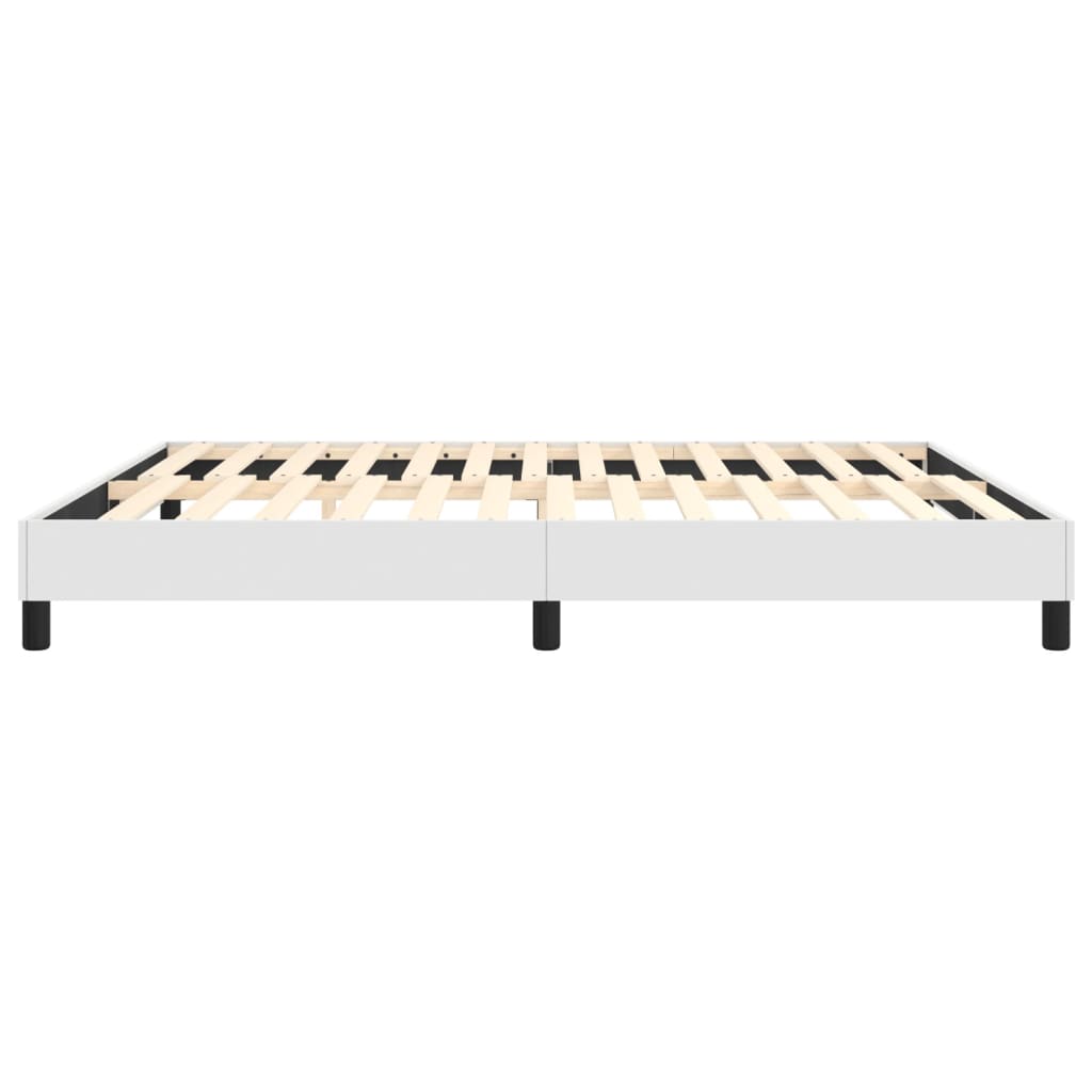 Minimalist white platform bed frame with wooden slats and black legs