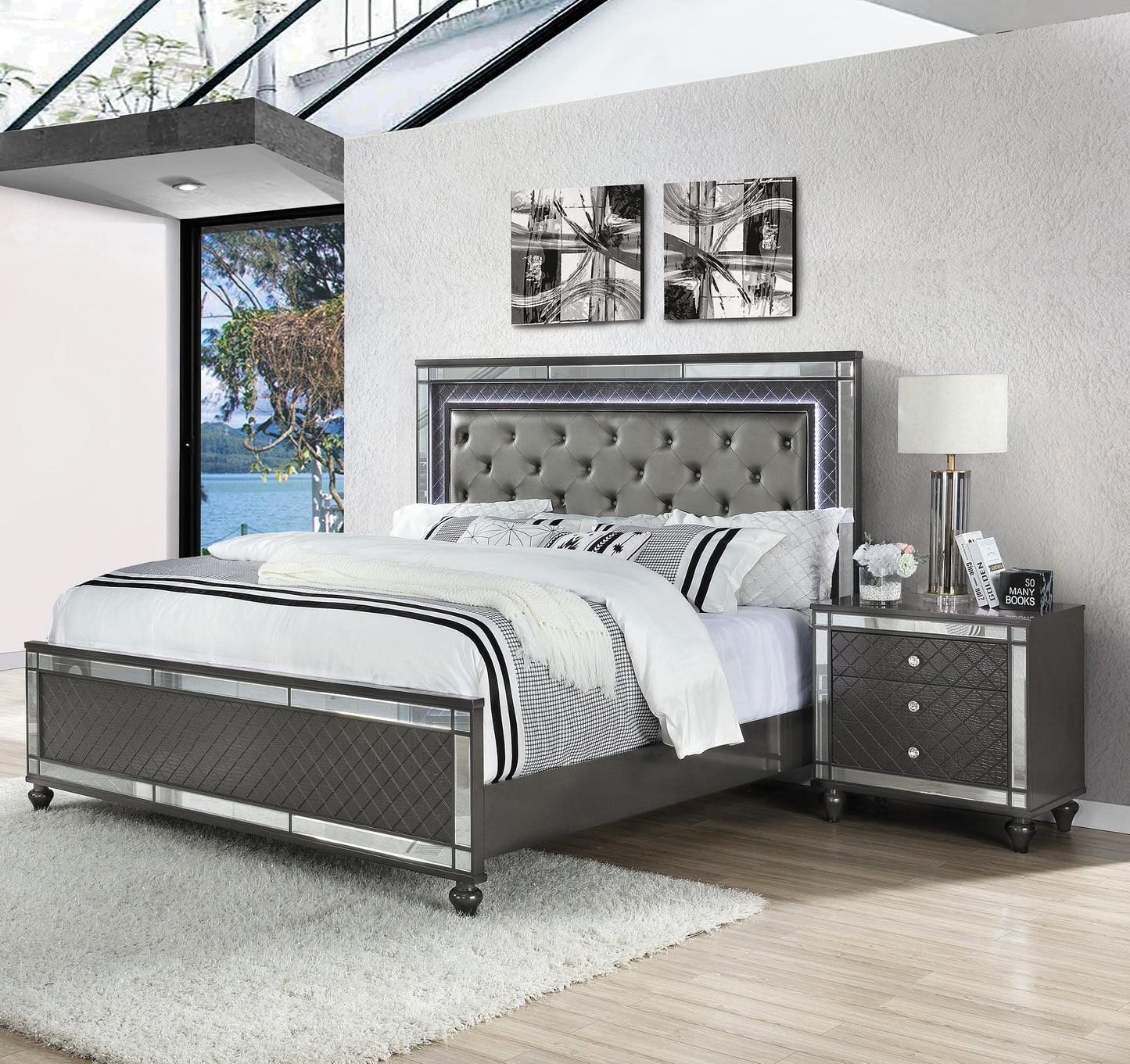 Gray tufted king bed with mirrored accents and diamond tufting