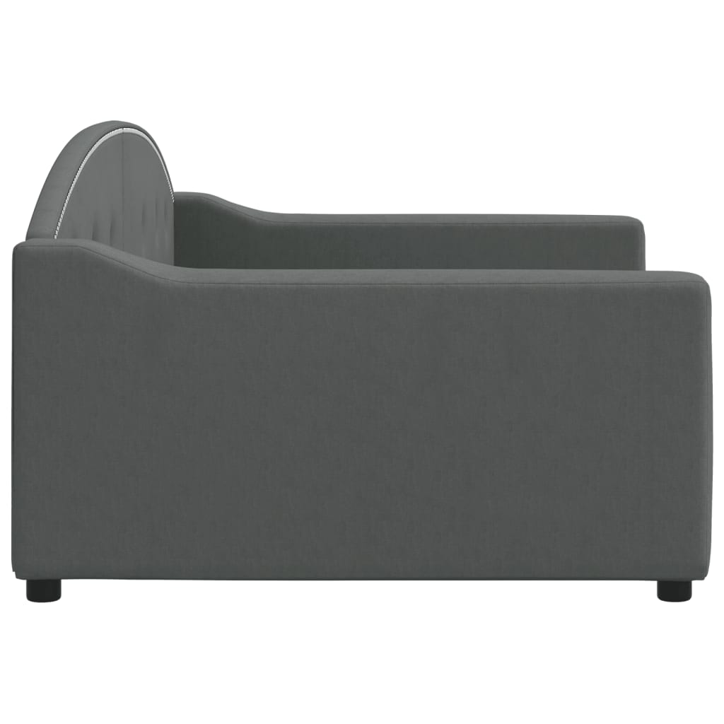 Gray upholstered daybed with tufted back and nailhead trim
