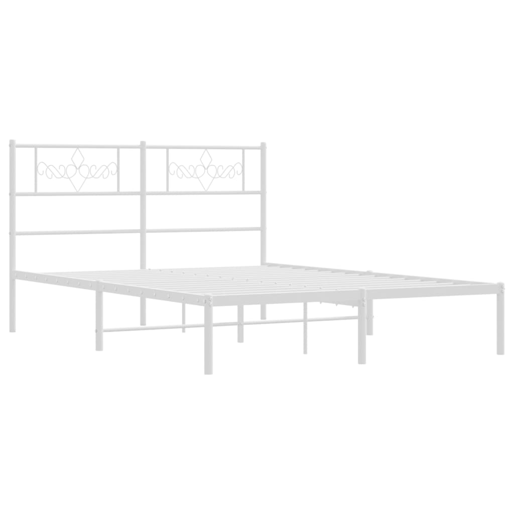 White metal bed frame with decorative headboard and mattress