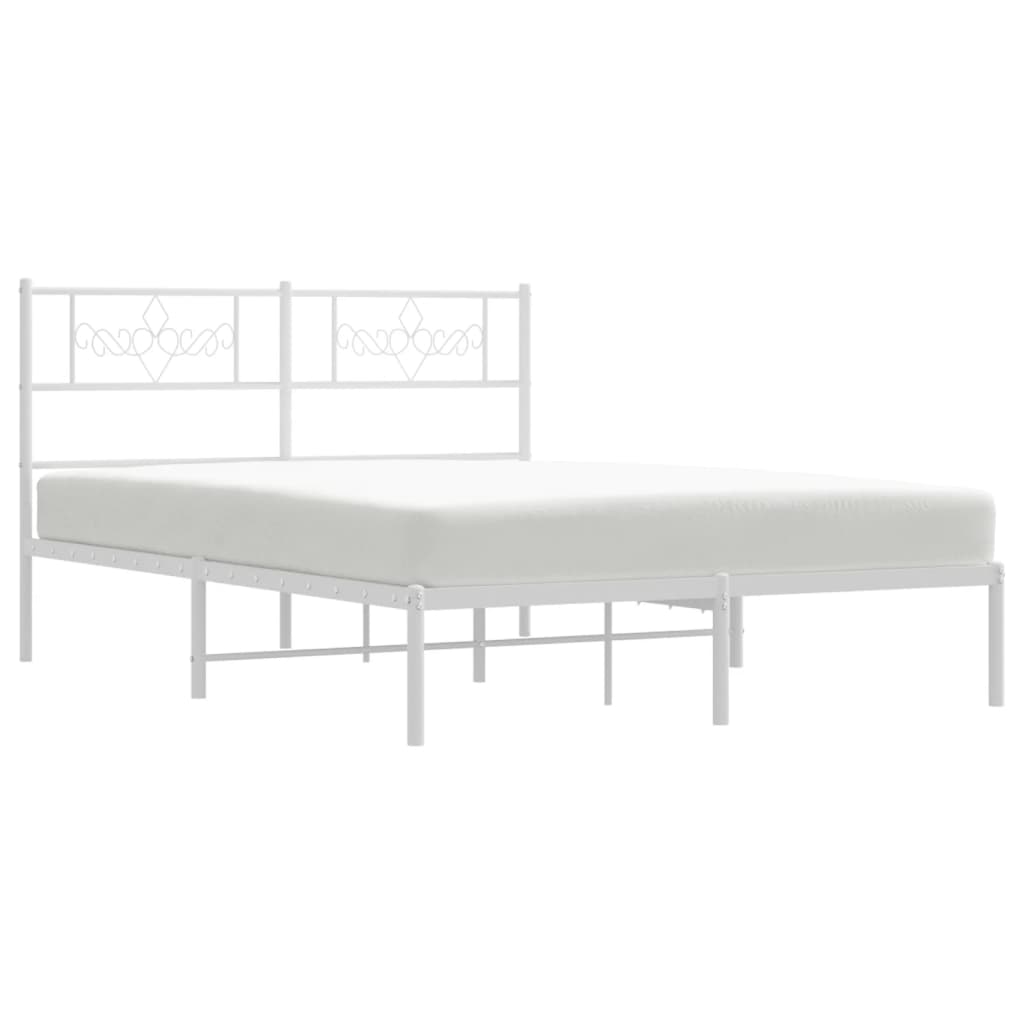 White metal bed frame with ornate headboard and slatted base