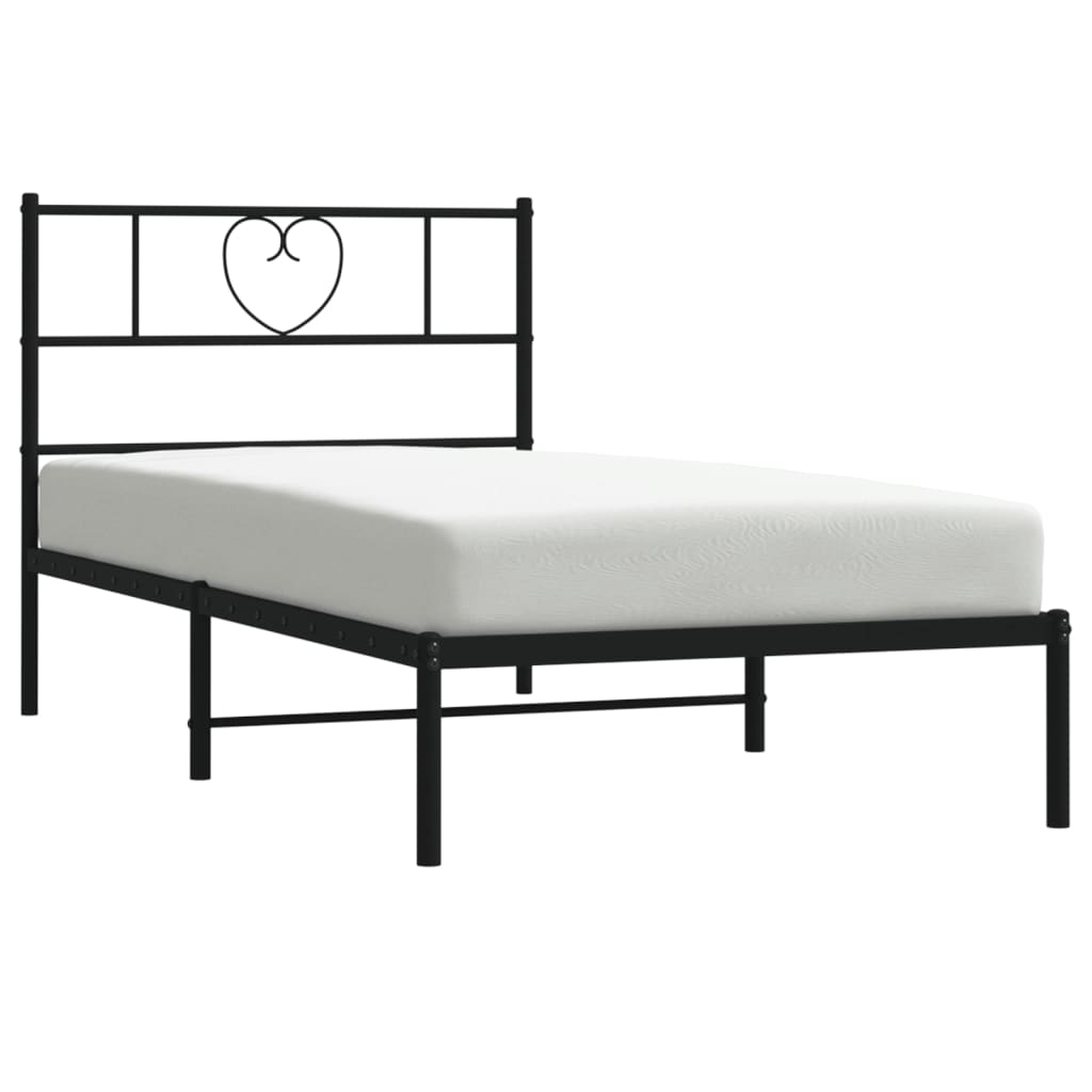 Black metal twin bed frame with heart headboard and mattress