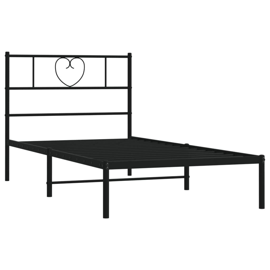 Black metal bed frame with heart headboard and white mattress