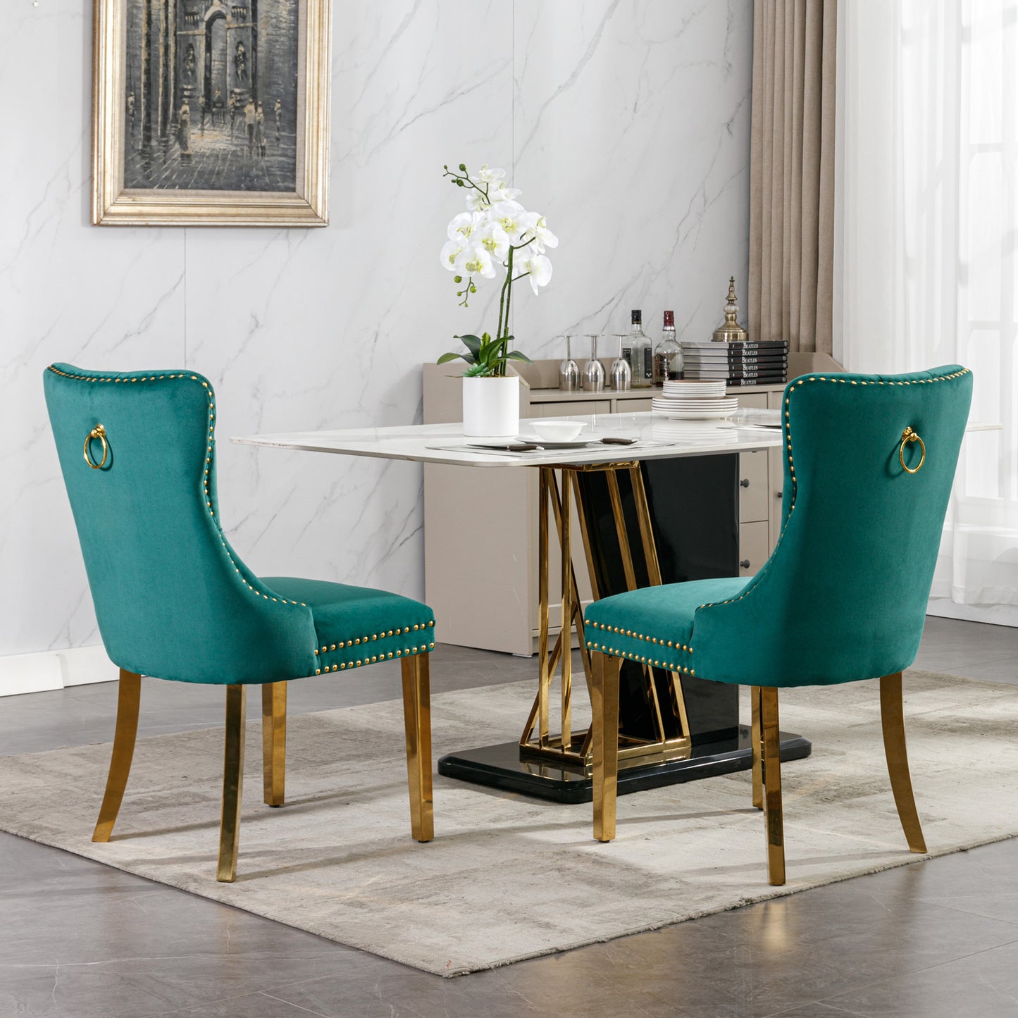Teal velvet dining chair with gold ring pull and brass legs