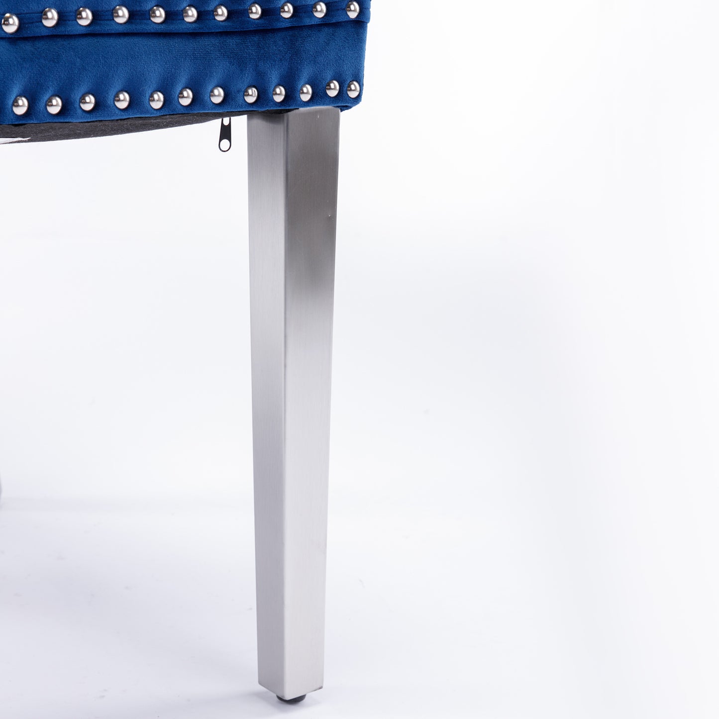 Deep blue velvet accent chair with silver nailhead trim and brushed metal legs