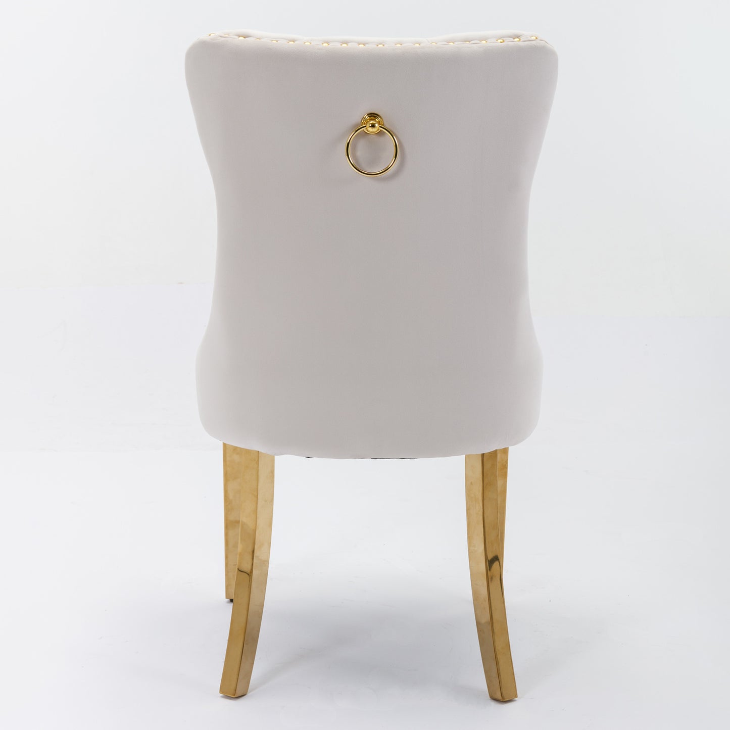 Light grey velvet dining chair with gold ring pull and gold legs