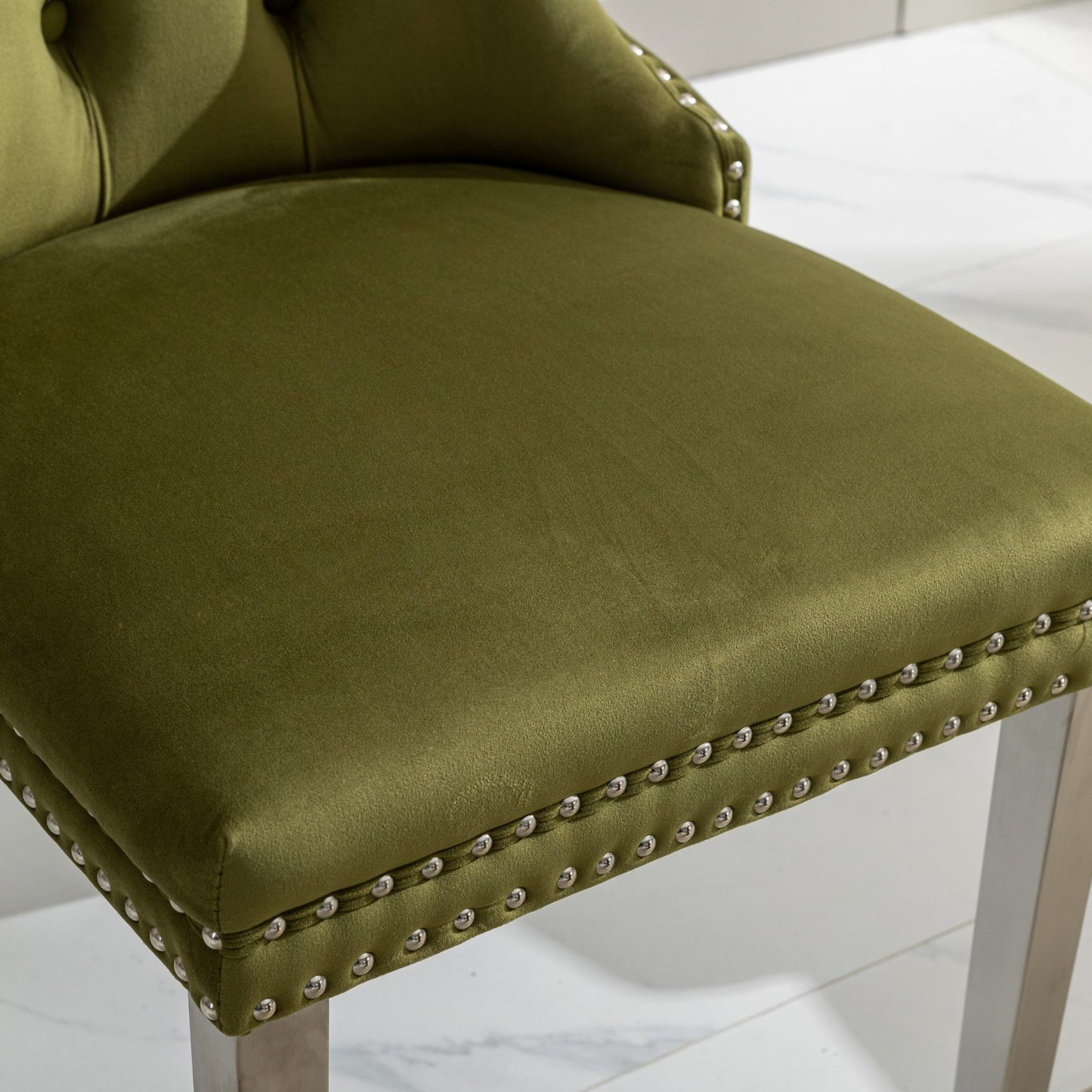 Olive green velvet bar stool with silver nailhead trim