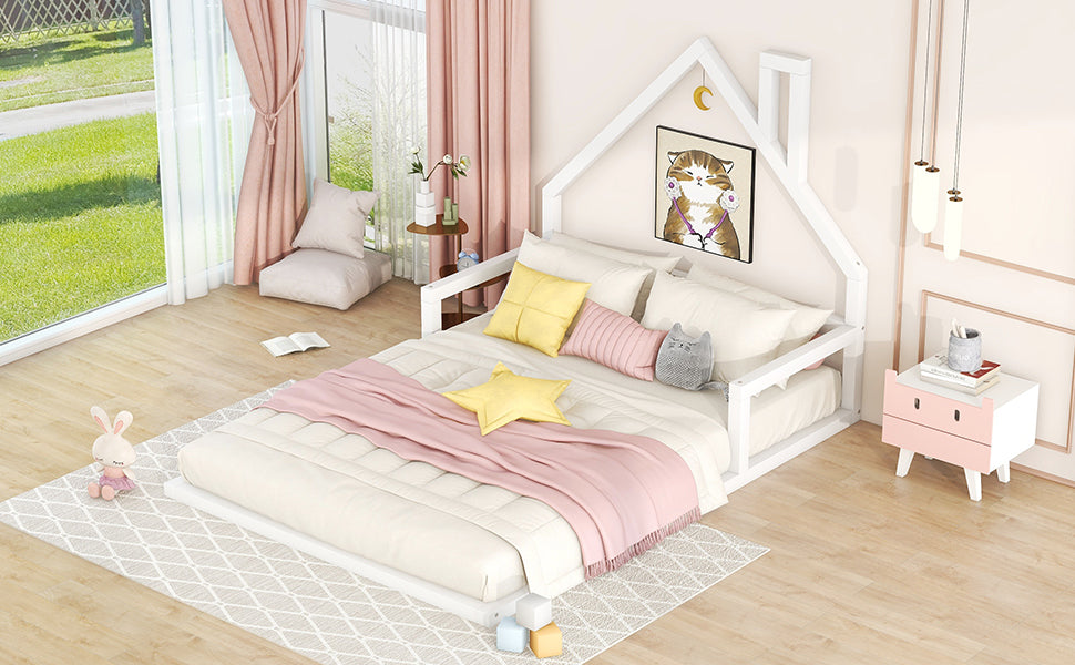 White wooden house bed frame with plush toys and pink bedding