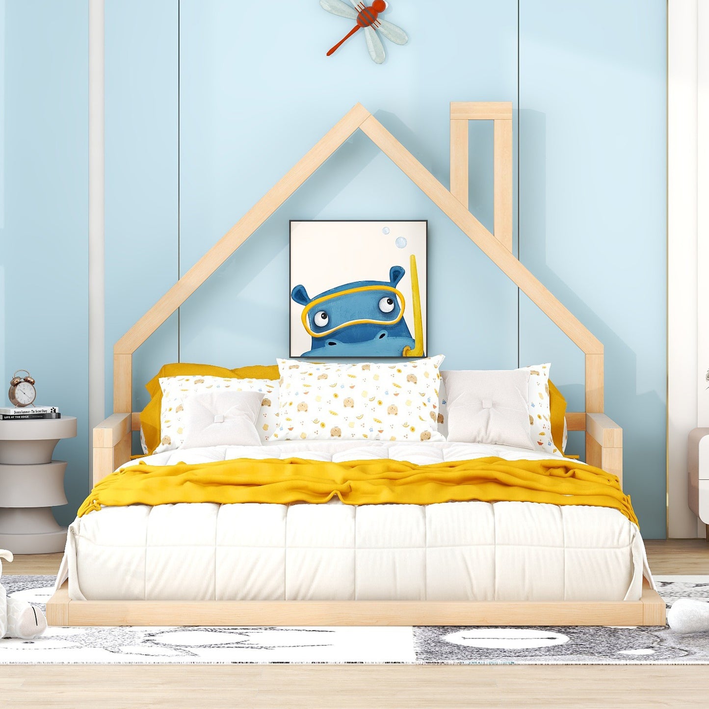 Wooden house bed frame with blue walls and hippo art
