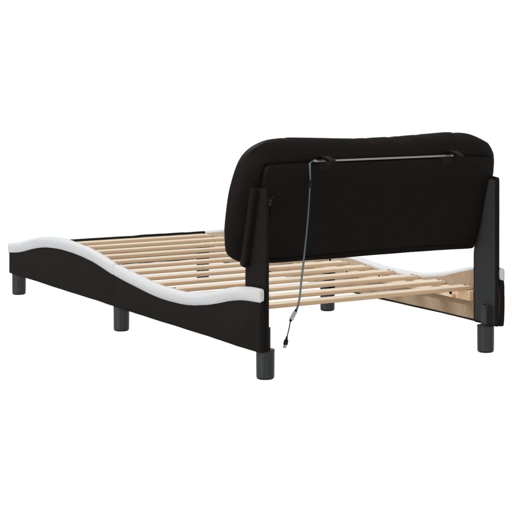 Black upholstered bed frame with adjustable headboard