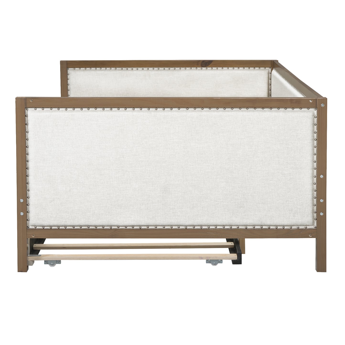 Upholstered wooden daybed with nailhead trim and light linen fabric