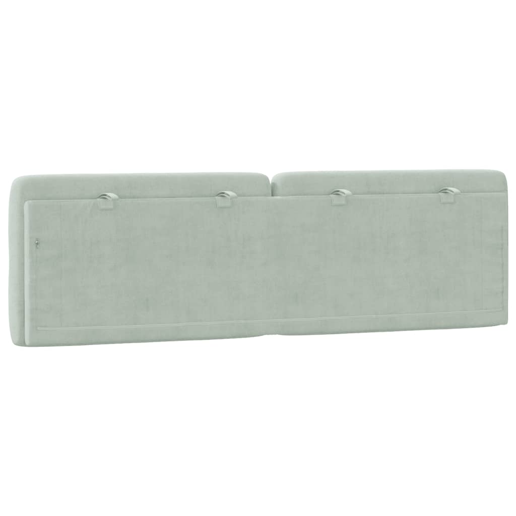 Light gray tufted fabric headboard with diamond pattern