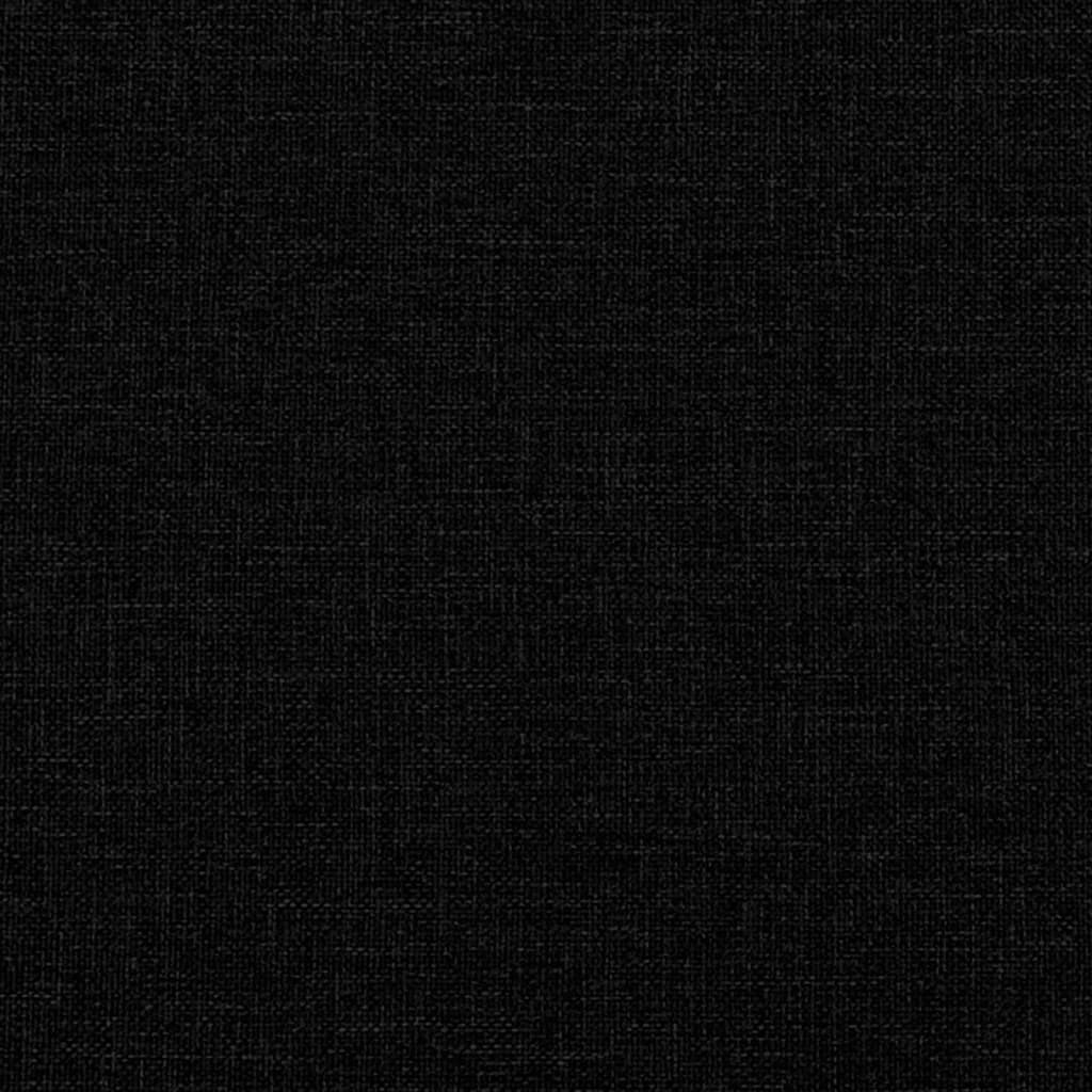 Closeup of textured black fabric on a plush armchair cushion