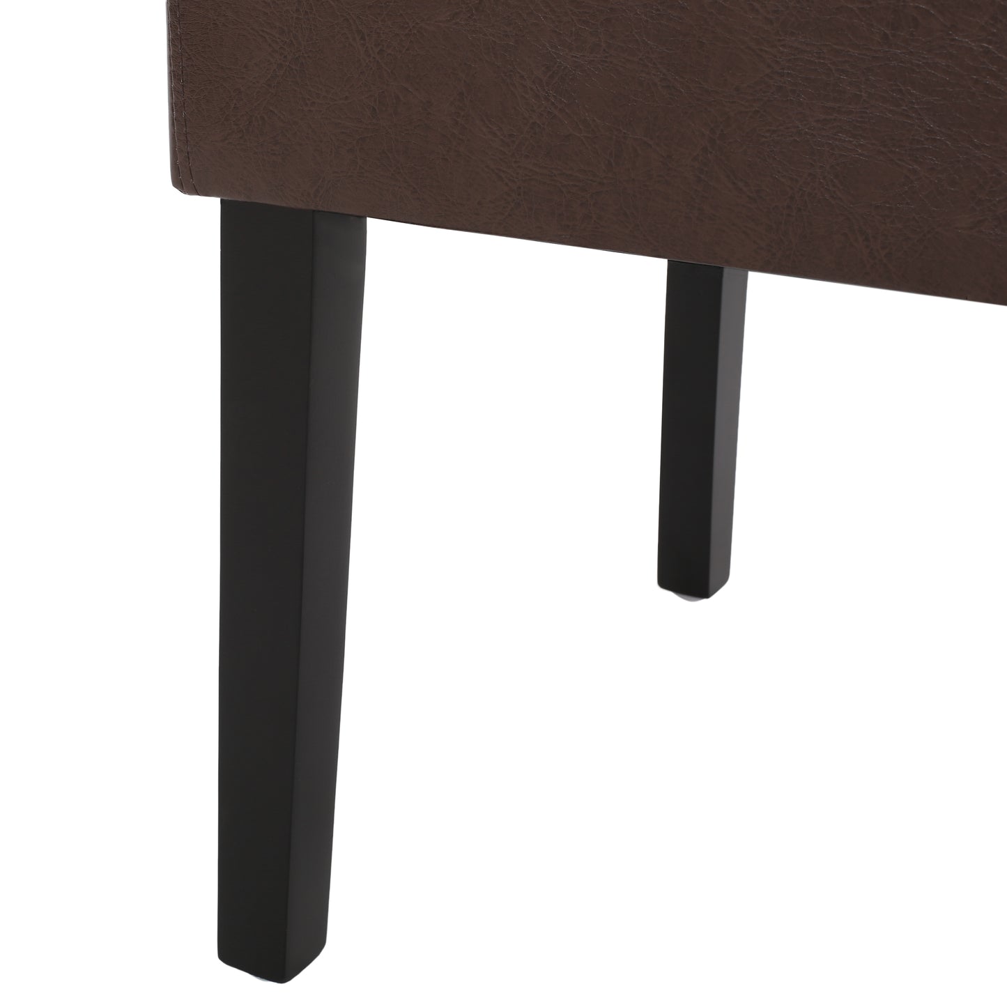 Brown faux leather couch detail with black tapered legs