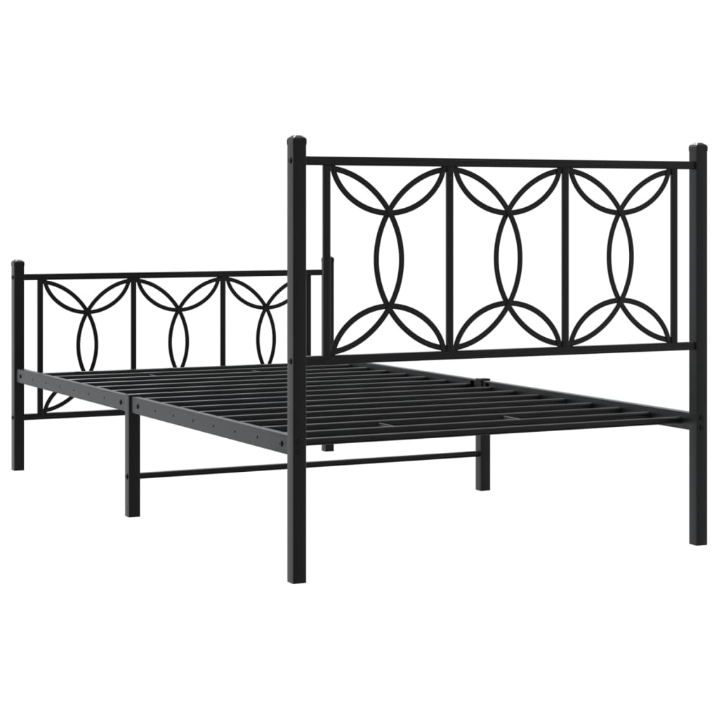 Black metal twin bed frame with ornate headboard and footboard