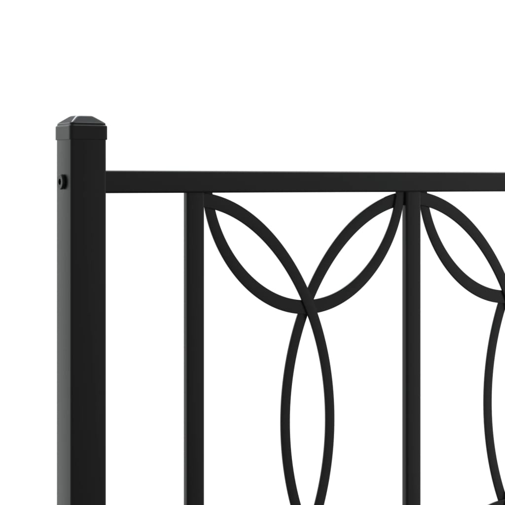 Black metal bed frame with ornate circular headboard and footboard design