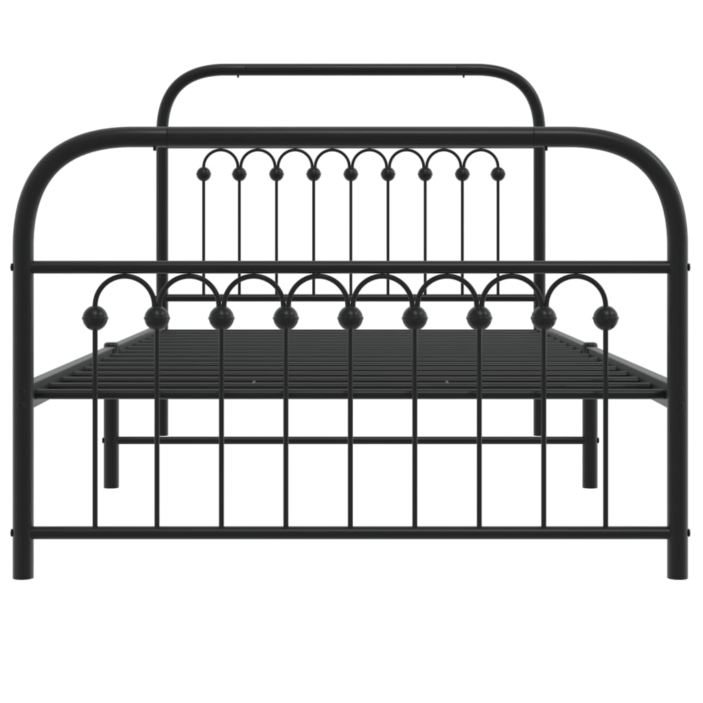 Black metal bed frame with a decorative arched headboard and footboard