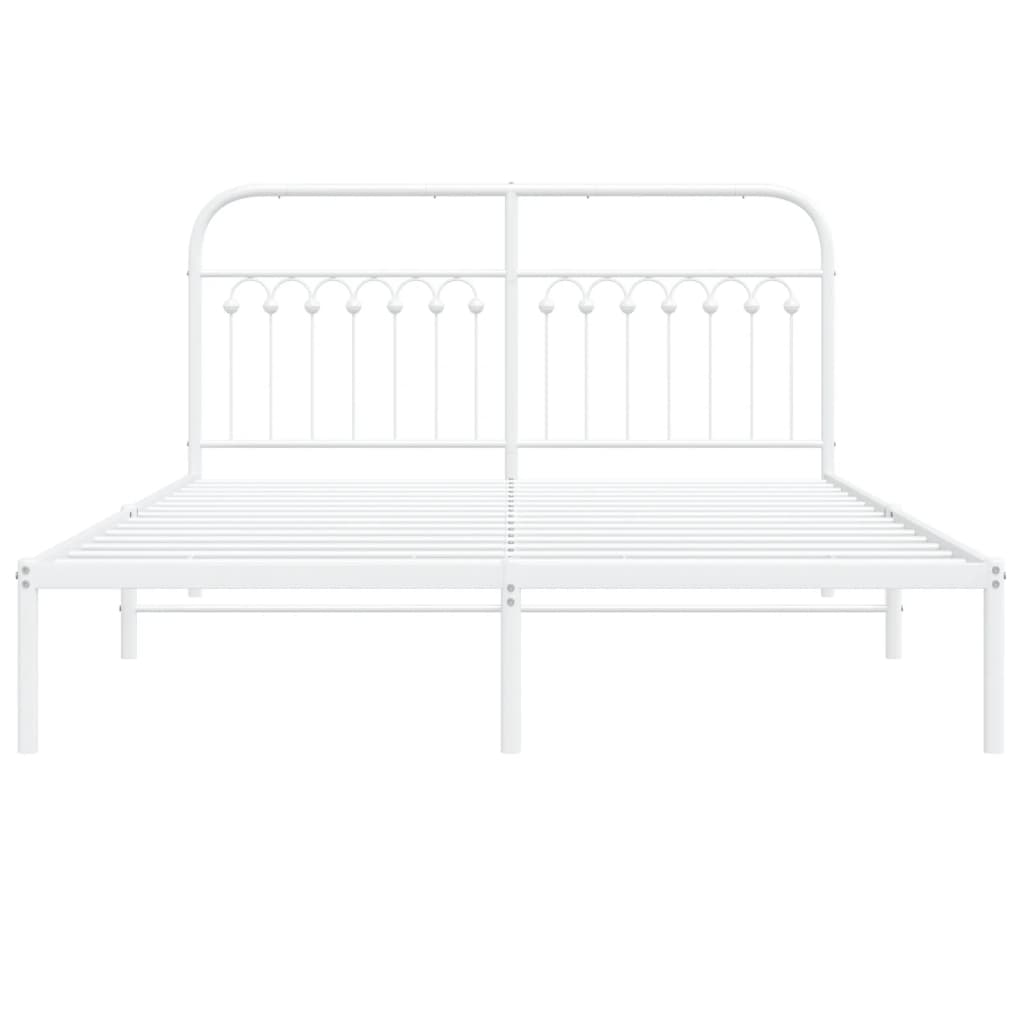 White metal twin bed frame with arched headboard and decorative spindles